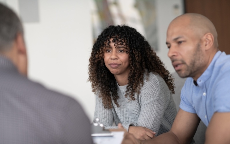 a couple discussing treatment for addiction