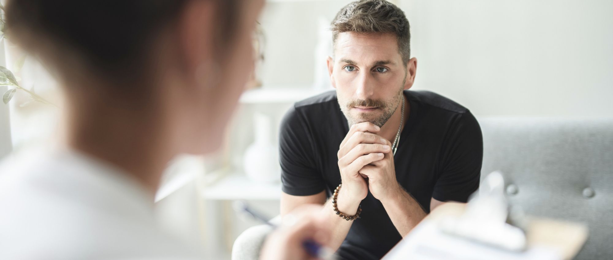A man discussing the Full-Day Outpatient Treatment Program offered at Renova Behavioral Health, a rehab center in Peabody, MA.