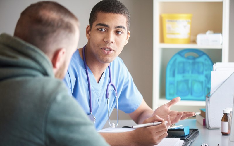 A doctor and client discussing detox